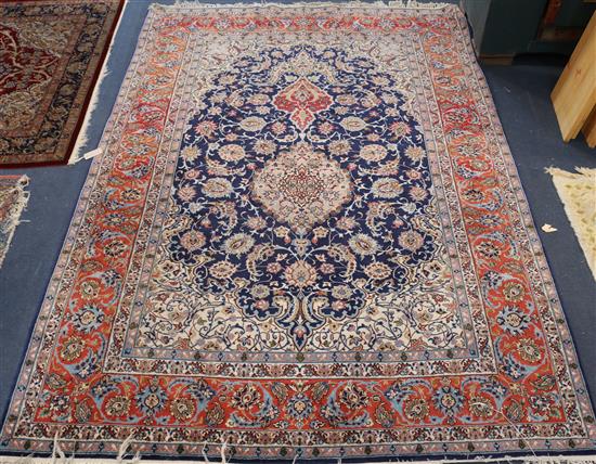 A Tabriz blue medallion rug 222 x 156cm.